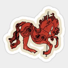 a red horse sticker sitting on top of a white surface