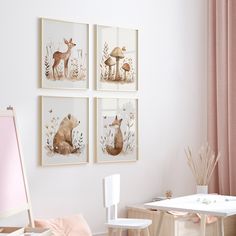 three framed pictures hang on the wall above a desk and chair in a child's room