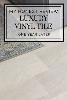 a white tile floor with the words my honest review luxury vinyl tile one year later