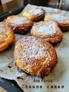 some type of pastry sitting on top of a piece of paper with powdered sugar