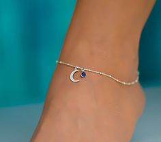 This anklet has a moon charm with an evil eye. The ankle bracelet is sterling silver 925. It is a dainty piece of jewelry that is great for the summer. The anklet has an extension so it can be adjusted to fit comfortably with different shoes. I can also customize the size for you, so feel free to message me if you need a custom order, or if you have any questions. Evil Eye Anklet Silver, Evil Eye Anklet, Anklets Indian Silver Modern, Silver Anklet, Evil Eye Jewelry Bracelet, Payal Designs Silver, Evil Eye Bracelet Silver, Capsule Wardrobe Jewelry, Silver Anklets Designs