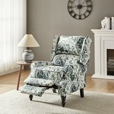 a living room with a clock on the wall and a chair in front of it