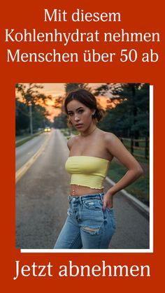 a woman standing in the middle of a road with her hands on her hips and looking at the camera