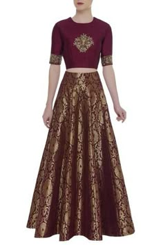 Bring home this embroidered crop top with brocade work skirt and give your clothing collection a fine upgrade.
Embroidered and brocade work
Round neckline and short sleeves
Comes with skirt
Long and flared silhouette - Aza Fashions Brocade Skirts And Tops, Crop Tops Indian Style, Skirt And Crop Top Indian, Designer Lehanga, Formal Skirts, Golden Lehenga, Long Skirt And Top, Traditional Skirts, Indian Wedding Lehenga