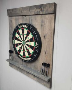 a dart board mounted to the side of a wall