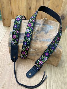 the lanyard strap is decorated with colorful flowers