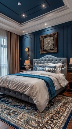 a bedroom with blue walls and carpeted flooring is pictured in this image, the bed has an upholstered headboard