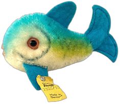 a stuffed fish with a tag attached to it