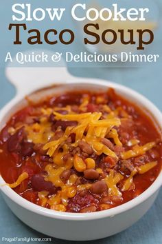 a bowl of slow cooker taco soup with beans and cheese on the side