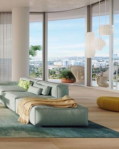 a modern living room with large windows overlooking the city