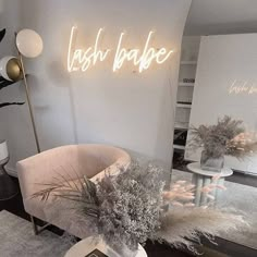 a living room filled with furniture and a neon sign on the wall above it's mirror