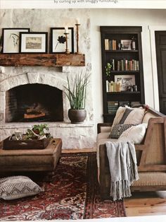 a living room filled with furniture and a fire place