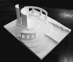 an architectural model of a building on a table