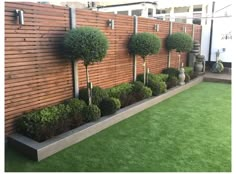 a wooden fence with some trees in it