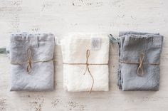 three linen bags tied up with twine