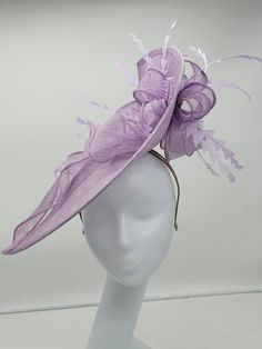 Beautiful lavender stiffened sinamay Fascinator. This vibrant colors will add elegance to any,  bridesmaid,  rehearsal dinner,  Wedding guest,  cocktail party, or church - Ready to ship  - Lightweight - Free Shipping - Fast shipping - Customize by adding different color flowers and or feathers Check my store for styles and colors.  Hatsandpearls.etsy.com Find more at my website: Www.hatsandpearls.com  Reach out to me if you can't find what you are looking for.  I can make cake custom orders and help you style and match your outfit  Tag and share your pictures when you wear and style our hats.  Instagram: @hats_pearls Facebook: Hats Pearls Thank you for visiting and happy shopping! Luxury Purple Feathered Fascinator, Spring Party Sinamay Headpiece, Spring Party Headpieces In Sinamay, Elegant Purple Hats For Spring, Elegant Purple Hat For Spring, Lavender Fitted Hat With Curved Brim, Spring Purple Wide Brim Fascinator, Fitted Headpiece For Church And Royal Ascot, Fitted Lavender Hats For Spring