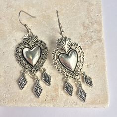 These Silver Sacred Heart Earrings Make A Statement. The Dark Patina In The Small Details Of The Charms Adds To The Lovely Handmade Feel. Silver Plated Ear Wires & Charms. Approx. Size: 2.5"L, 7/8"W New, Handmade By: Jpeace Designs *See My Other Listings In This Sacred Heart Collection* Religious, Rockabilly, Dia De Los Muertos, Day Of The Dead, Punk, Rock N Roll, Edgy Jewelry, Lady Biker, Skull, Virgin De Guadalupe, Mexico, Western, Sundance, Artsy, Vintage Antique Style Dream Accessories, Edgy Jewelry, Diamond Dangle Earrings, Lady Biker, Western Jewelry, Small Details, Design Silver, Sacred Heart, Heart Jewelry