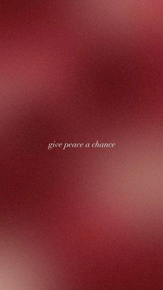 the words give peace a chance written in white on a red background