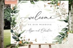 a welcome sign with greenery on it and the words, welcome to our wedding