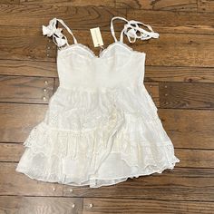 Iconic Ruffled Mini Dress In Sweet White Eyelet With An Adjustable Tie-Sleeve Detail From Shabby Chic Favorite Loveshackfancy. Perfect For Graduations, Sorority Rush Or Events, Date Night, Vacations, Or Brides At Bachelorette Parties, Engagement Parties, Engagement Photos, Showers, Courtyard Weddings, Rehearsal Dinners, Or Backyard Weddings! New With Tags. Size L. Fancy White Dress, Tiered Ruffle Mini Dress, Ruffled Mini Dress, Sorority Rush, Backyard Weddings, Engagement Parties, Lilac Dress, Pink Floral Dress, Ruffle Mini Dress