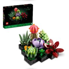 a lego planter with flowers and plants in it next to a card board box