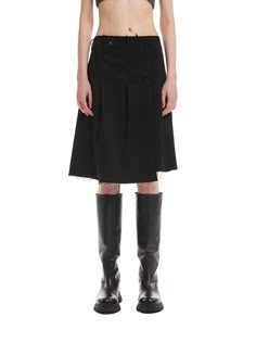 Editor's NoteTRUNK PROJECT's Pleated Wrap Skirt is made out of sturdy and high quality wool blend fabric that is suitable to wear during the fall and winter season. With pleats and raw edges throughout, it gives a refined yet distinctive mood. It has unique design points including asymmetric hem, twist lock closure, and wrap closure with double buttons. With a medium length that drops right above the knee, you can style it for both casual and rough, or refined yet unique outfit. - Twist lock closure- Asymmetric hem- Waistband with belt hoops- Low riseMeasurements (in.)XS/S/L- Length: 21.26 in / 22.05 in- Waist: 14.17 in / 14.96 in- Hip: 20.47 in / 21.26 inModel info: Height 5'9, Weight 110 lbsComposition & Care- Wool 12%, Rayon 27%, Polyester 58%, Span 3%- Refer to care labelDesig Fall Cargo Skirt With Belt Loops, Fall Asymmetrical Skirt With Belt Loops, Wool Relaxed Fit Skirt For Spring, Wool Relaxed Skirt For Spring, Black Wool Lined Skirt, Wool Flared Skirt With Relaxed Fit, Wool Bottoms With Relaxed Flared Skirt, Knee-length Wool Pleated Skirt, Wool Knee-length Pleated Skirt