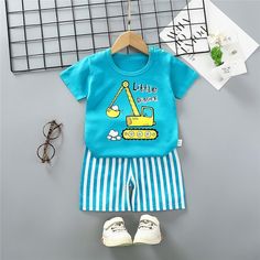 Grow Boy Cartoon Excavator Pattern Pajamas Sets - PrettyKid Light Blue Cotton Pajama Party Set, Spring Cartoon Print Sets For Bedtime, Blue Cotton Bedtime Sets, Spring Bedtime Sets With Cartoon Print, Spring Cartoon Print Playwear Set, Spring Cotton Sets With Cartoon Print, Blue Cotton Family Matching Sets, Spring Cartoon Print Playtime Sets, Playful Cotton Sets With Cartoon Print