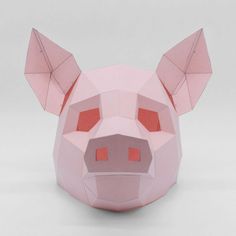 a pink pig mask with red eyes and ears