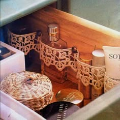 the contents of a wooden box are neatly organized