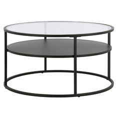 an oval glass table with black metal frame