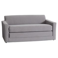 a gray couch sitting on top of a white floor