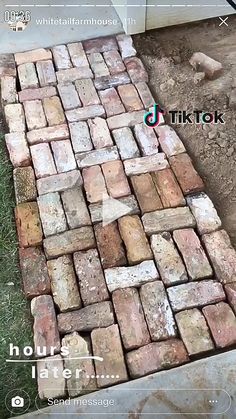 an old brick walkway is laying on the ground