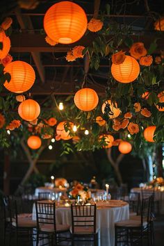 the tables are decorated with paper lanterns and flowers