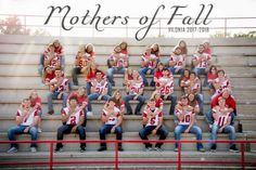 a group of people sitting on the bleachers in front of some stairs with their football jerseys