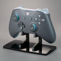 a close up of a controller on a stand