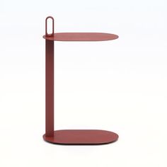 a red table with a metal stand on it's side and the top half off