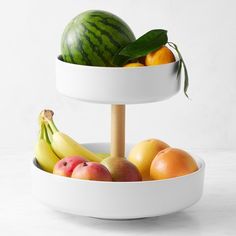 two tiered bowls with fruit in them