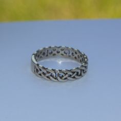 Celtic style sterling silver ring, knotwork band Hallmarked sterling silver ring cast in a traditional Celtic design.     * UK ring size: O /US ring size: 7.     * Weight: 2.5gms. Please follow the link below to view more of our rings: https://www.etsy.com/uk/shop/IceniSilvercraft?ref=seller-platform-mcnav&section_id=28078018 Silver Celtic Rings, Celtic Band, Celtic Style, Celtic Design, Celtic Rings, Celtic Designs, Silver Brooch, Garnet Rings, One Ring