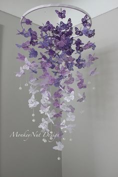 purple and white butterflies hanging from the ceiling