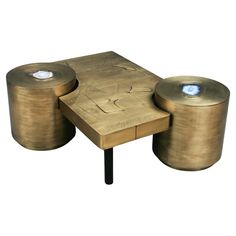 two tables with lights sitting on top of each other