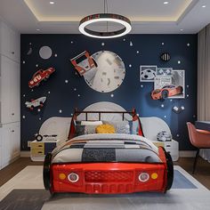 a child's bedroom decorated in red, white and blue with cars on the wall