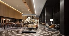 an elegant dining room with marble flooring and black walls, along with chairs and tables