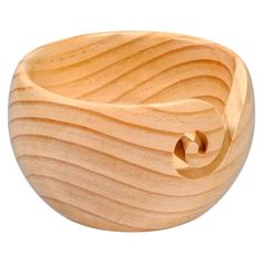 a wooden bowl that is shaped like waves