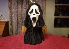 a scream mask sitting on top of a table