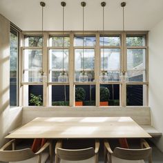 a table and chairs in front of a window