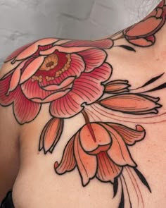 a woman's chest with flowers on it