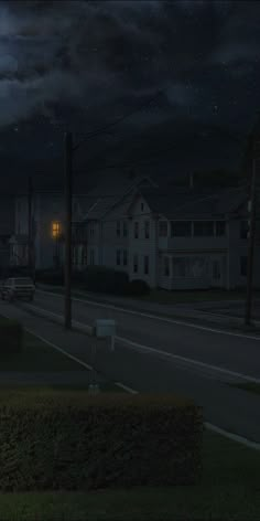 an empty street at night with the moon in the sky and some houses on the other side