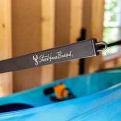 a blue kayak with the name surf your board on it