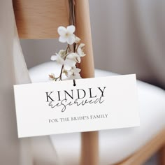 a wooden chair with a sign that says kindly reserved for the bride's family