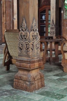 an old wooden table and chairs in a room